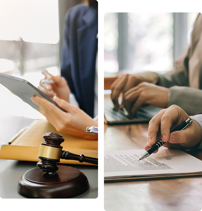 A judge 's gavel and two people working on papers.